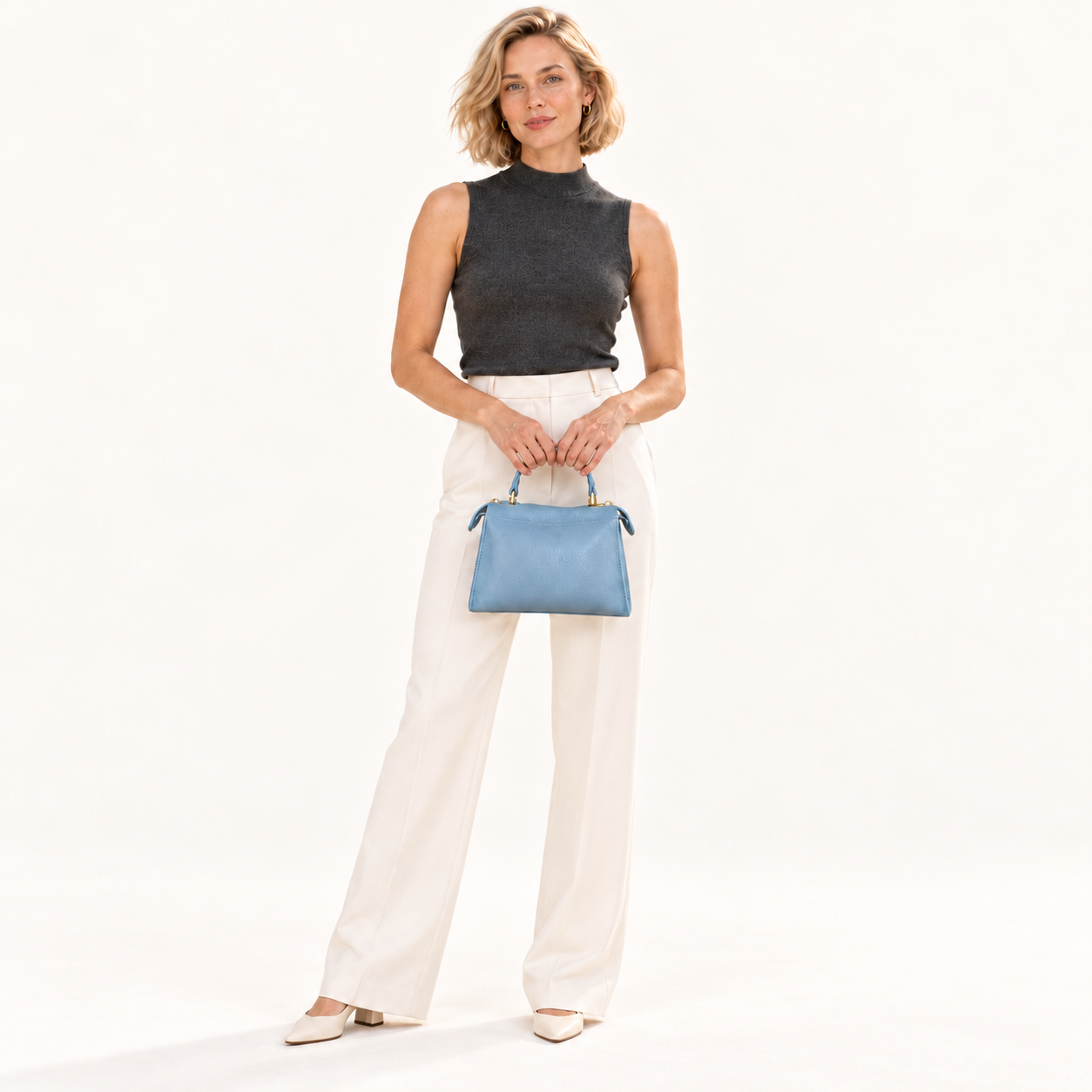 Leather Mini Top Handle Bag in 
lichtblauw, gedragen